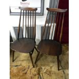 A Set of 4 Ercol elm wood spindle back chairs.