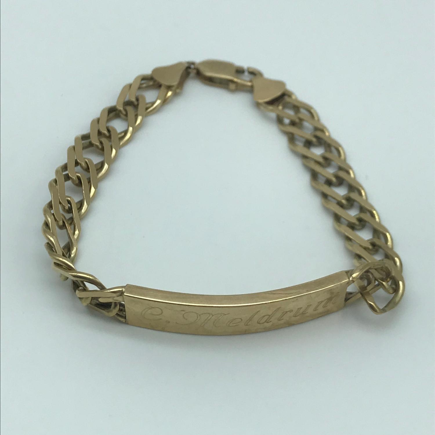 A 9ct gold gents curb I.D Bracelet, Engraved (Could be buffered off) Measures 20.5cm in length and