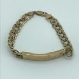 A 9ct gold gents curb I.D Bracelet, Engraved (Could be buffered off) Measures 20.5cm in length and