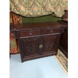 A Solid hardwood oriental sideboard, Two drawer & two doors, Measures 89.5x120x38cm