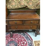 A 20th century solid oak two over one chest of drawers supported on pedestal barley twist legs.