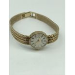 A 9ct gold ladies Longines wrist watch. In a working condition.