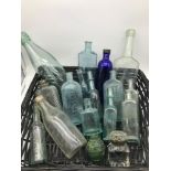 A Basket of old chemist and brewery bottles, also includes a Victorian ink pot and art deco