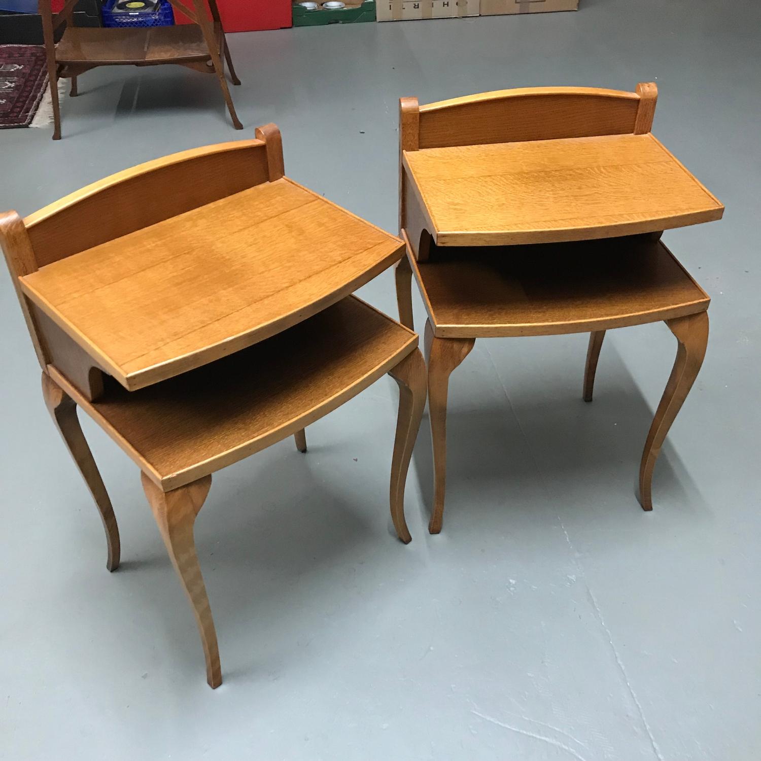 A Pair of Light oak Cabroile leg bed side tables. Measure 70x44x37cm