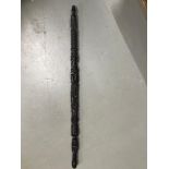 An Ebony African carved totem style walking stick. Measures 80cm in length