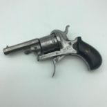 An antique six shot rim revolver marked 'Vigilant American model of 1879' with folding trigger.