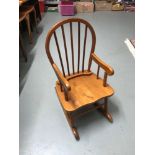 A Childs pine rocking chair.
