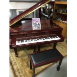 A Modern Steinhoff baby grand piano together with matching stool.