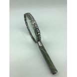 A London silver framed magnifying glass designed with a snake like scale handle, Made by Samuel