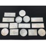 A Collection of 19th century hand carved Chinese mother of pearl game tokens.