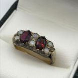 A Birmingham gold and silver ladies opal and garnet ring, ring size M 1/2, Weighs 3.94 grams