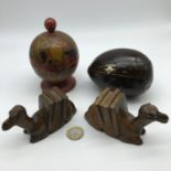 A Pair of olive wooden carved camels c1920, Coconut casket & Arts and crafts Russian string box.