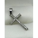 An 18ct white gold and diamond cross pendant. Weighs 1.60grams