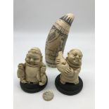 A Reproduction Scrimshaw together with two festive monk figures.
