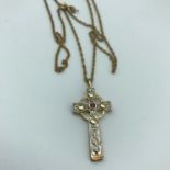 925 silver and silver gilt Celtic cross pendant designed with a single ruby stone, together with a