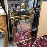 A Contemporary gilt frame ornate mirror, Measures 124x65cm