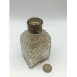 A Georgian London silver topped perfume bottle, has original stopper, possibly has a gold coin to