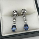 A Pair of 18ct white gold earrings set with diamonds and blue stones, weighs 3.93 grams