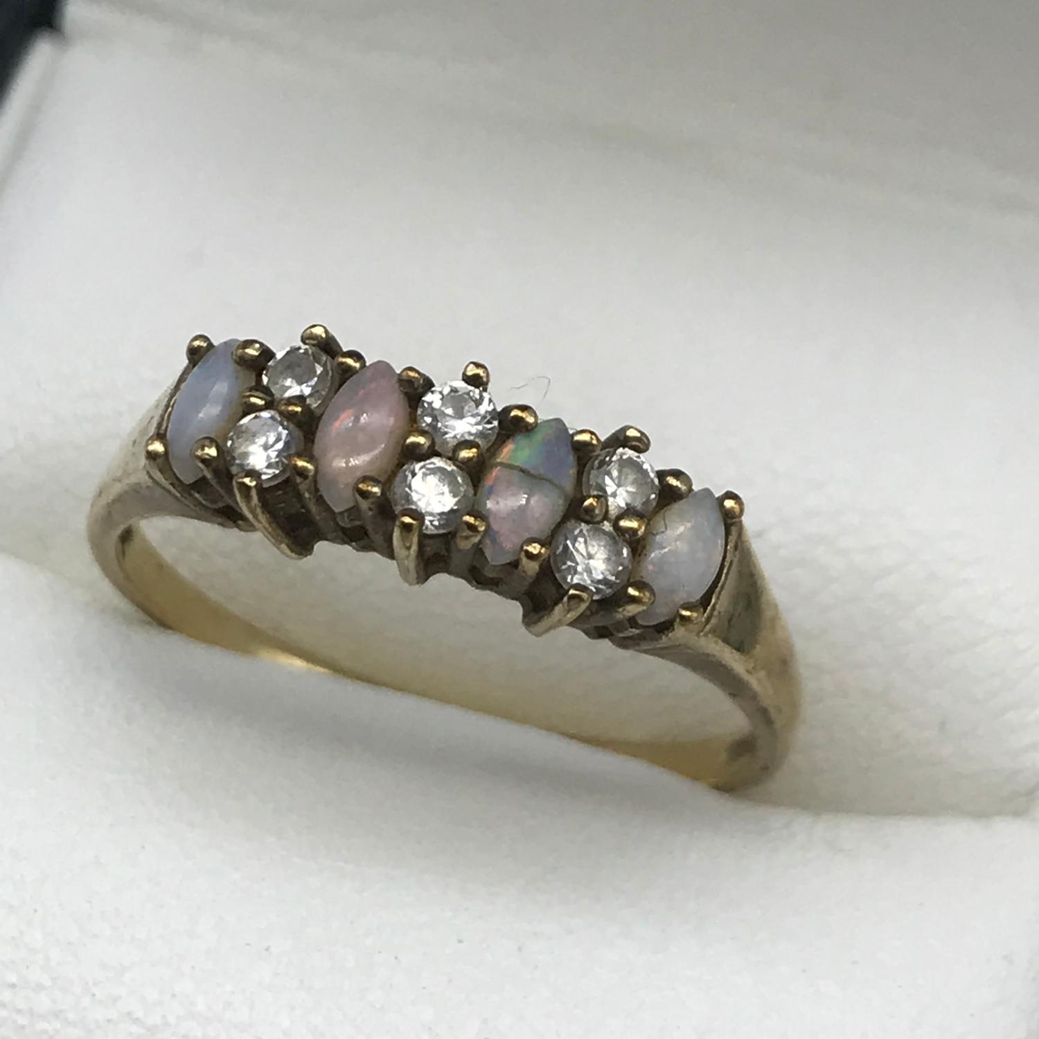 A Ladies 9ct gold, opal and cz stone ring, Ring size R, Weighs 1.86grams