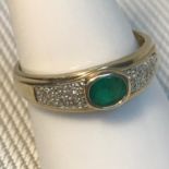A Lovely 9ct gold, diamond cluster and single emerald stone, Ring size N, Weighs 2.16grams