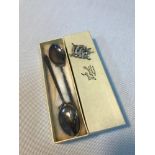 A Pair of London silver tea spoons designed with golf club handles, Together with a Birmingham