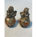 A Pair of Chinese white metal and jade/hard stone foo dog statues. Measure 6cm in height