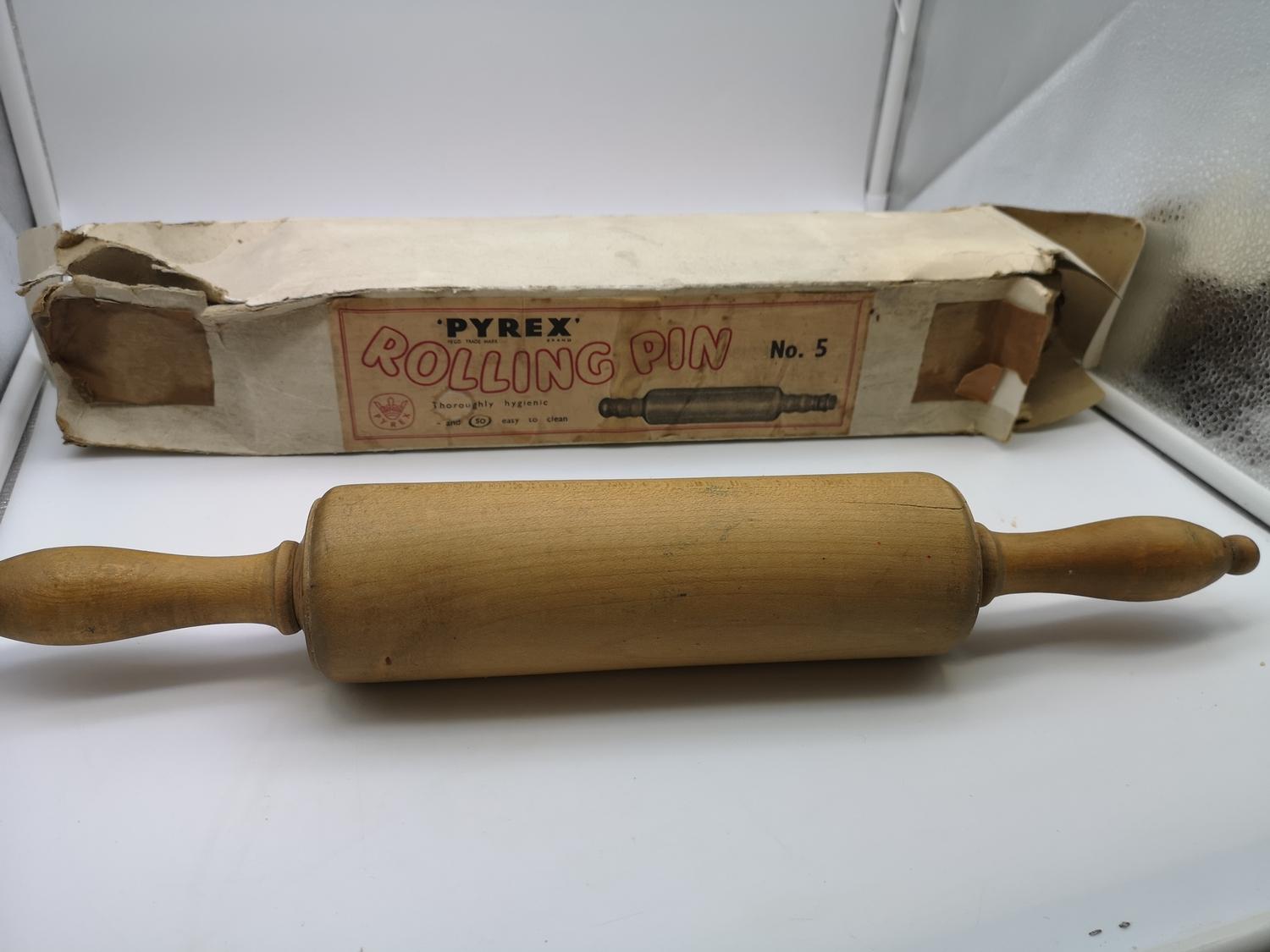 Pyrex glass rolling pin with cork stopper end and original box, together with a wooden rolling pin