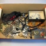 A Small box containing various costume jewellery and silver jewellery.