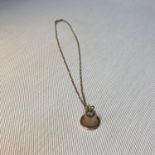 A Ladies 9ct gold link necklace together with a 9ct gold Victorian Bell pendant. Weighs 5.50Grams