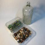 A Tub of Antique marbles, A Tub of semi precious agate stones and a Co-operative glass soda bottle.