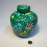 A Chinese enamel painted preserve pot, depicting raised designed flowers, beads and birds. Has a