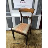 A Regency parlour chair, designed with a pillow top back support and Adam style turned leg supports.