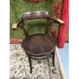 Antique bentwood arm chair.