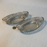 A Pair of London silver pierced bon bon dishes. Maker Skinner & Co. Measure 4.5x18.5x10cm