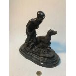 A Large Bronze sculpture on a marble plinth of a hunter with his dog. Signed Mene. Measures 27cm