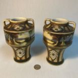 A Pair of Noritake hand painted double handle vases. Measures 16cm in height