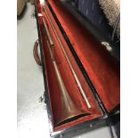 An early 1900's Trombone with fitted travel case, Engraved with floral designs and engraved with