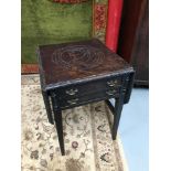 A Georgian side table designed with two under drawers and drop end sides. The top of the table is