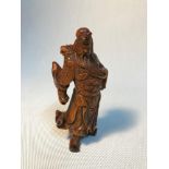 A Chinese boxwood hand carved warrior GuanGong netsuke. Measures 12cm in height