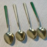 A Set of Danish Sterling silver and enamel tea spoons produced by H. Guttermann & Son.