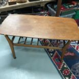 A Retro teak Coffee table with spar design shelf. Produced by Nathan.