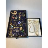 A Tray of vintage costume jewellery which includes Silver & agate pendant, Bronze lion and snake