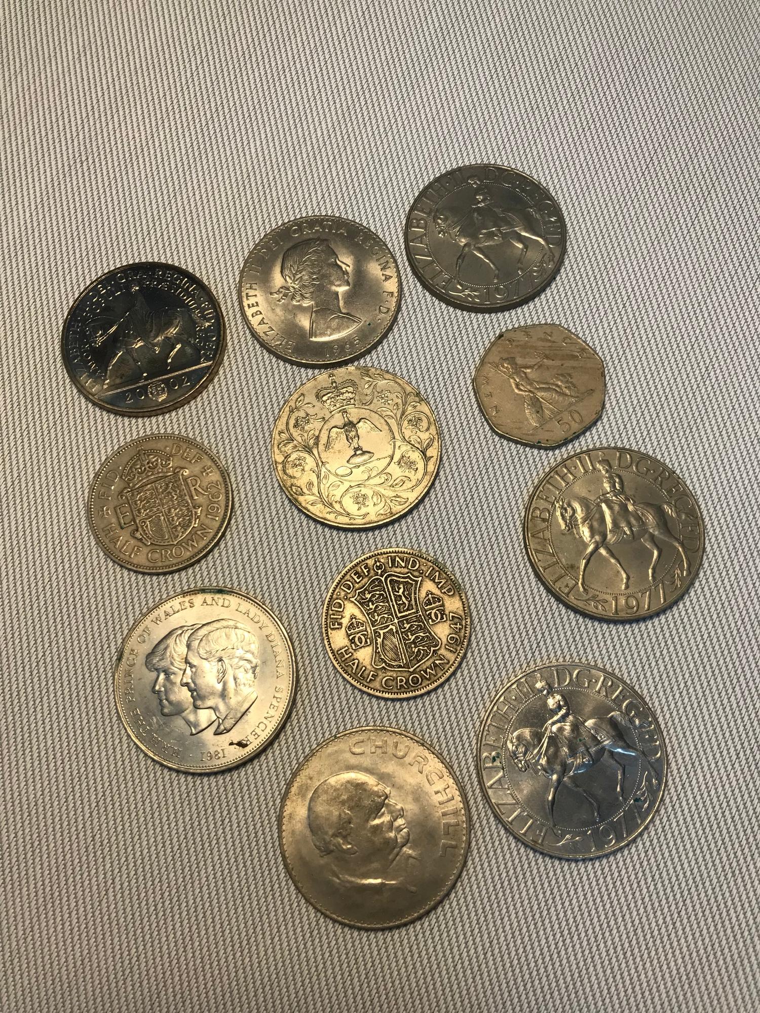 A Lot of various dated crowns which includes a 2002 two pound coin.