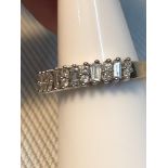 A Beautiful example of a ladies 9ct gold and 0.50ct diamond ring. Diamonds consist of 5 Baguette cut