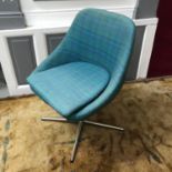 A Retro swivel tub chair with removable cushion