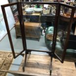 A Victorian unusual wood and glass fire screen, fitted with two clear glass door sections. Single