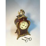 A French 19th century Louis XIV Style tortoiseshell & Ormolu mounted mantle clock,.Ccomes with two