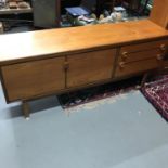 A Mid century teak pedestal sideboard produced by Nathan Furniture. Measures 76x183x45.5cm