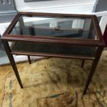 A Reproduction dark wood and glass shop display cabinet. Fitted with glass lift top and glass sides.