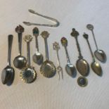 A quantity of Various silver hall marked souvenir spoon, Includes Georgian silver tea spoon and